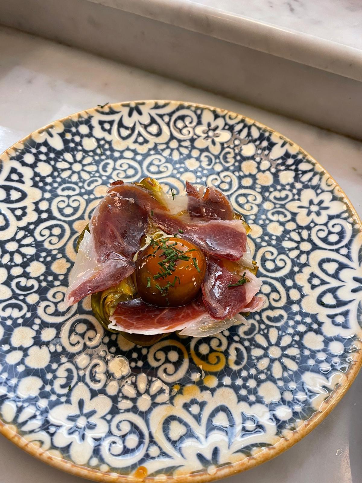 Artichoke flower, Iberian cured ham shoulder and cured egg yolk